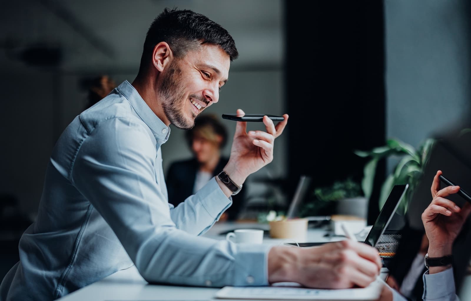 A salesperson sending a personalized voice message to a prospect
