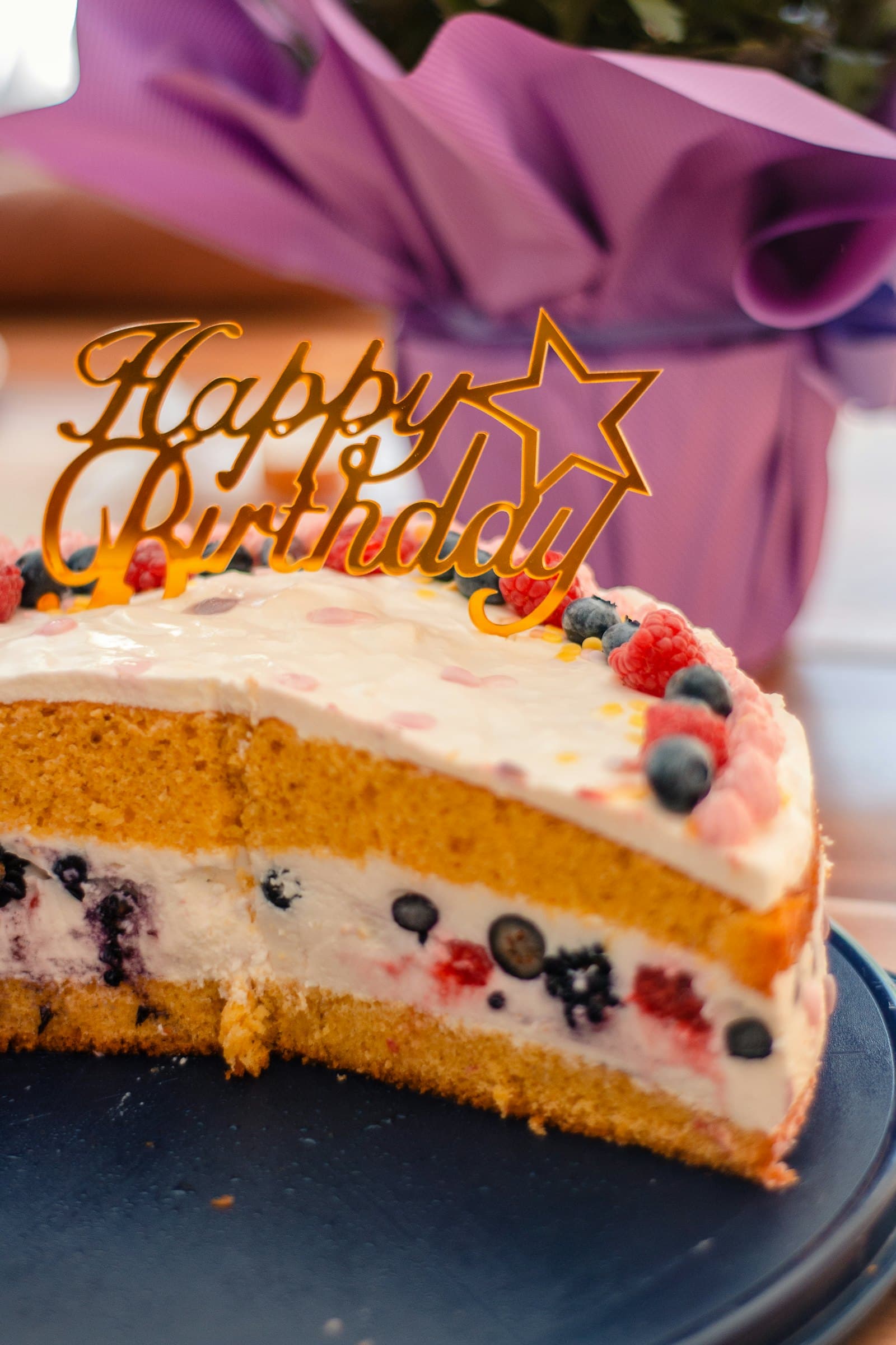 A birthday cake in a gift box, representing a physical gift sent to a prospect