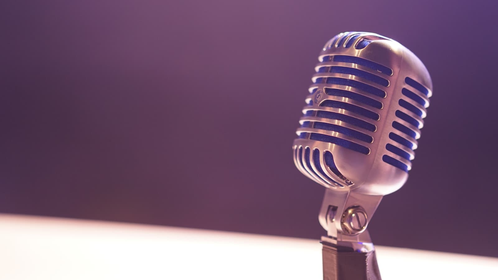 A podcast microphone in a studio, representing a prospect's published content